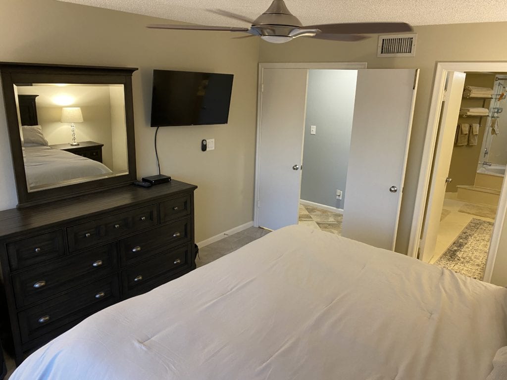 Master bedroom at Bahia 155 – king bed, 40-inch Smart TV, walk-in closet