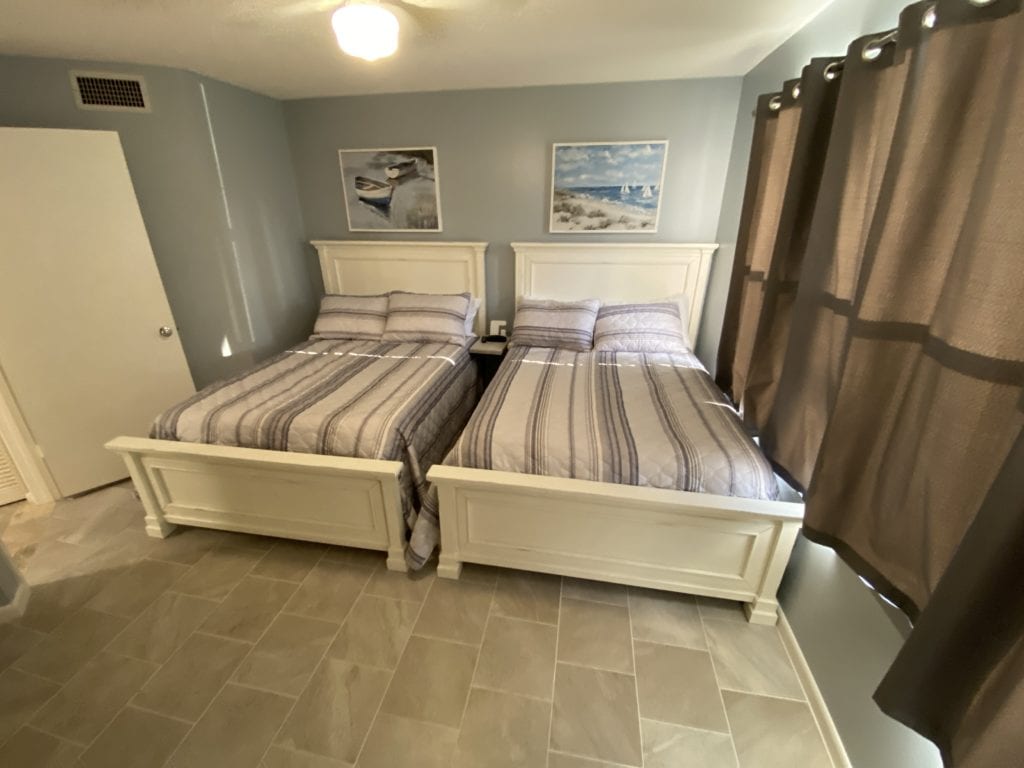 Guest bedroom with 2 full beds at Bahia 155 vacation rental, St. Pete Beach